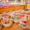 A Yo-Chi bar is decorated with pink and rainbow unicorn themed treats